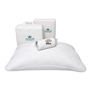 A white textured Crown Lift pillow shown with its branded storage bag and packaging box on a clean white background. The one inch soft add-on support core is resting on top of the crown lift pocket pillowcase