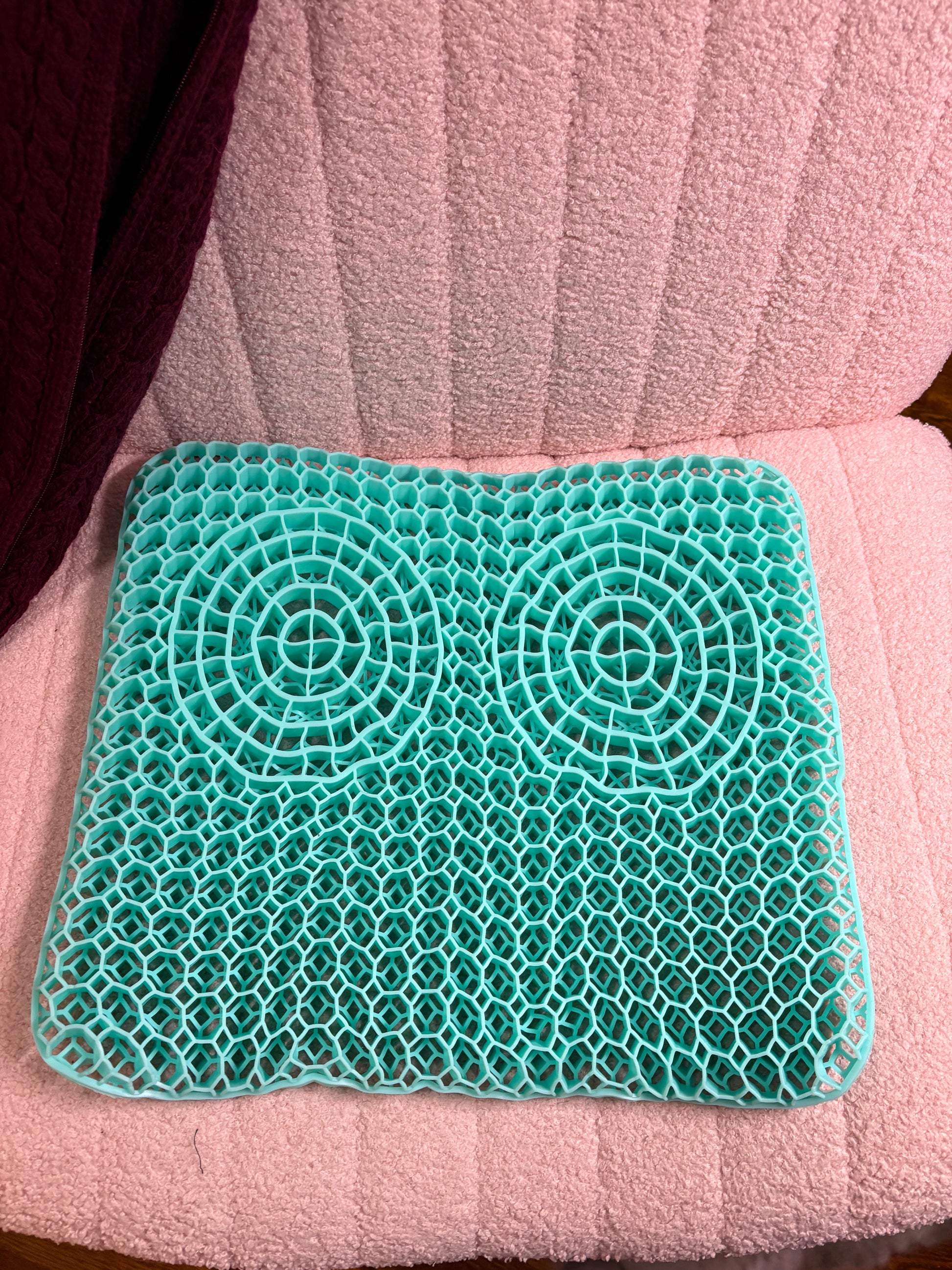 The Sanctuary Seat gel pad on a pink  office chair Sanctuary Sleep Pillow 
